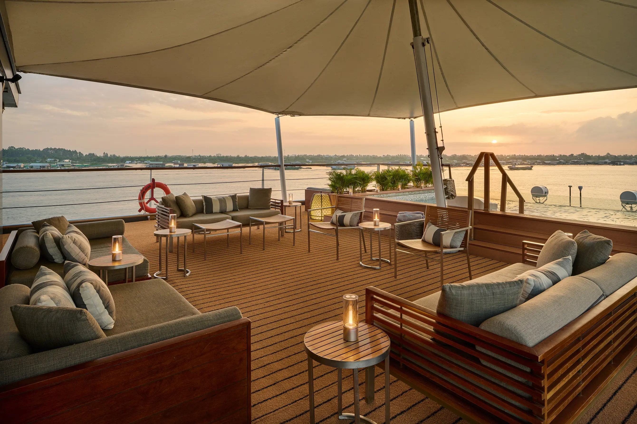 Sunset cruise on the Mekong River with a traditional boat in Cambodia