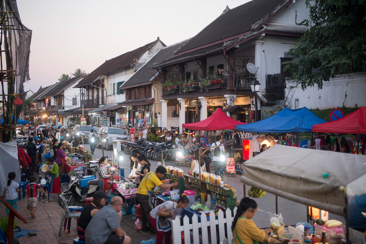 Delicious Lao street food being prepared at the vibrant Luang Prabang Night Market.