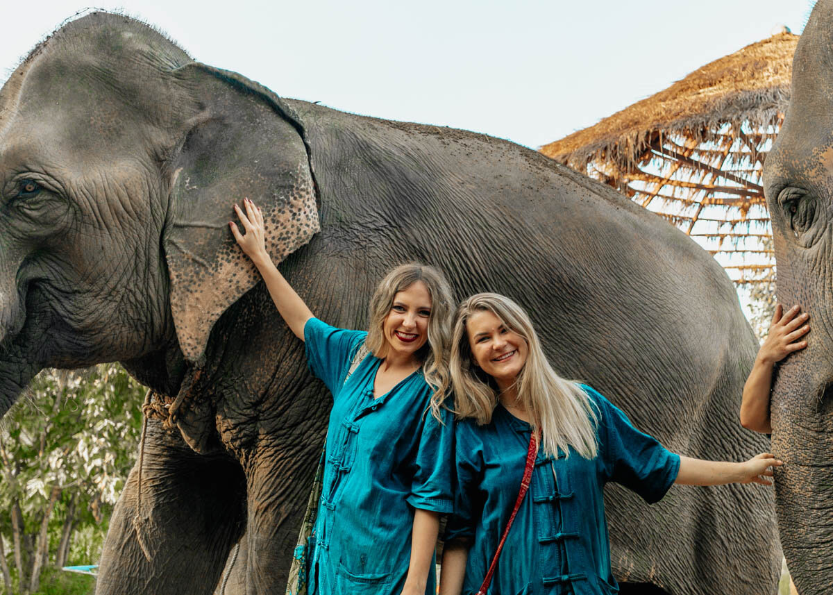 Travelers interacting with an elephant ethically at a sanctuary