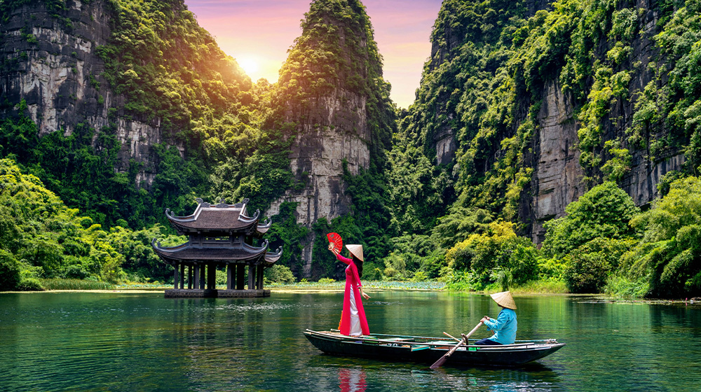 Ninh Binh captivates with limestone karsts, winding rivers, and ancient temples, offering a serene blend of nature, history, and rural charm.