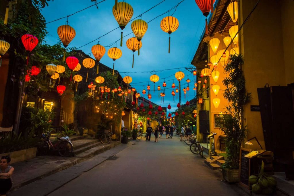 A vibrant lantern festival in Hoi An, Central Vietnam, with colorful lanterns illuminating the night sky and people enjoying the festivities.