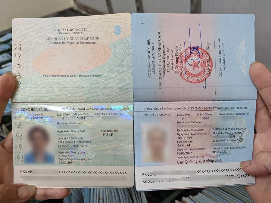 Two open pages of a Vietnamese passport showing the data page layout